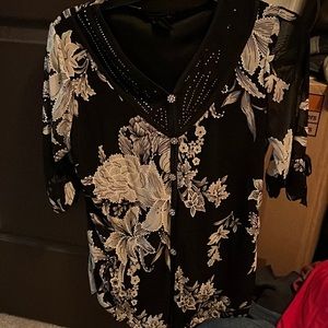 Used rhinestone quarter sleeve top. Black, white, and rhinestones. Flower design